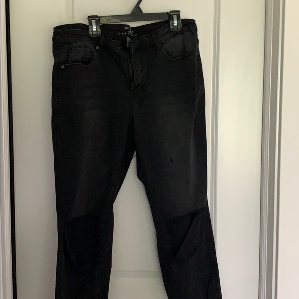 Black jeans with rips on the knees